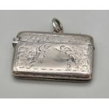 A Vintage Silver Vesta Case. Hallmarks for Birmingham 1927. Hinge works well. Comes with a chain