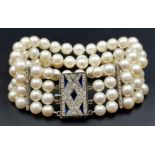 A 4 ROW AKOYA PEARL BRACELET WITH ART DECO STYLE 14K GOLD DIAMOND AND SAPPHIRE CLASP. 67.3gms