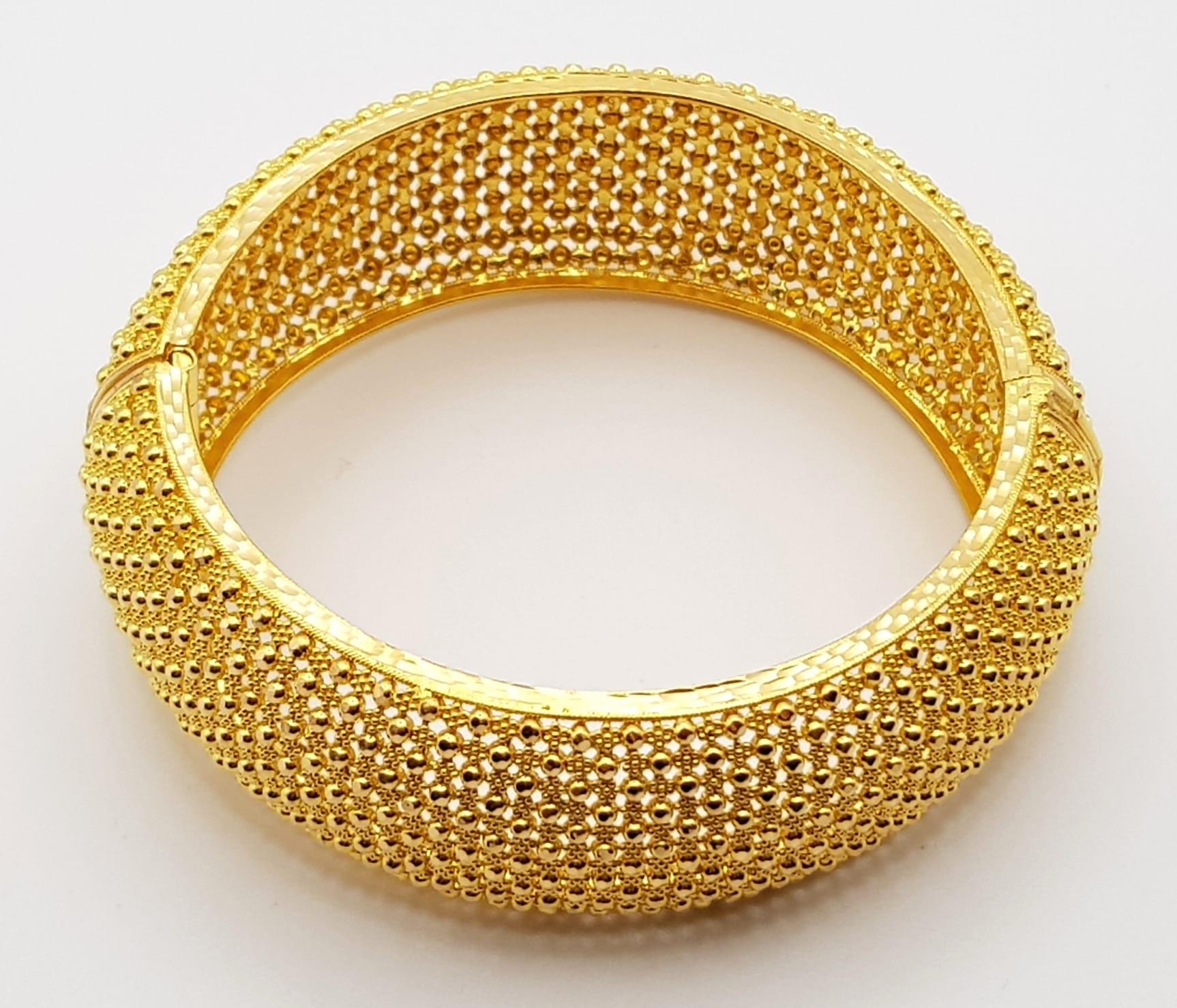 A 22k Yellow Gold Geometric Dimple Design Wide Bangle. 6cm inner diameter. 43.2g. - Image 2 of 5
