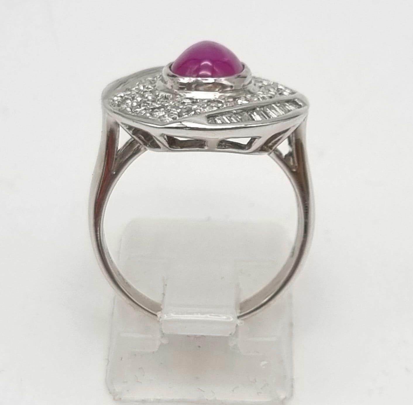 An 18K White Gold Burma Star Ruby and Diamond Ring. Central Burma Star ruby surrounded by a - Image 3 of 7
