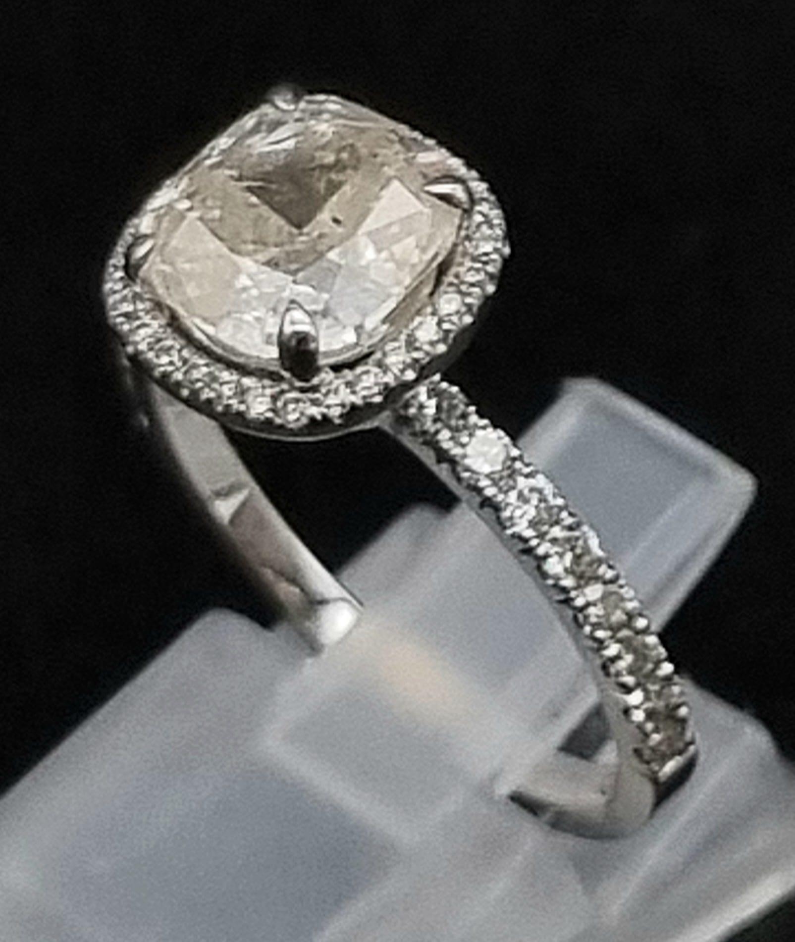 A Breathtaking 18K White Gold and Diamond Ring. A central 1.96ct cushion-cut central stone with 44 - Image 3 of 7