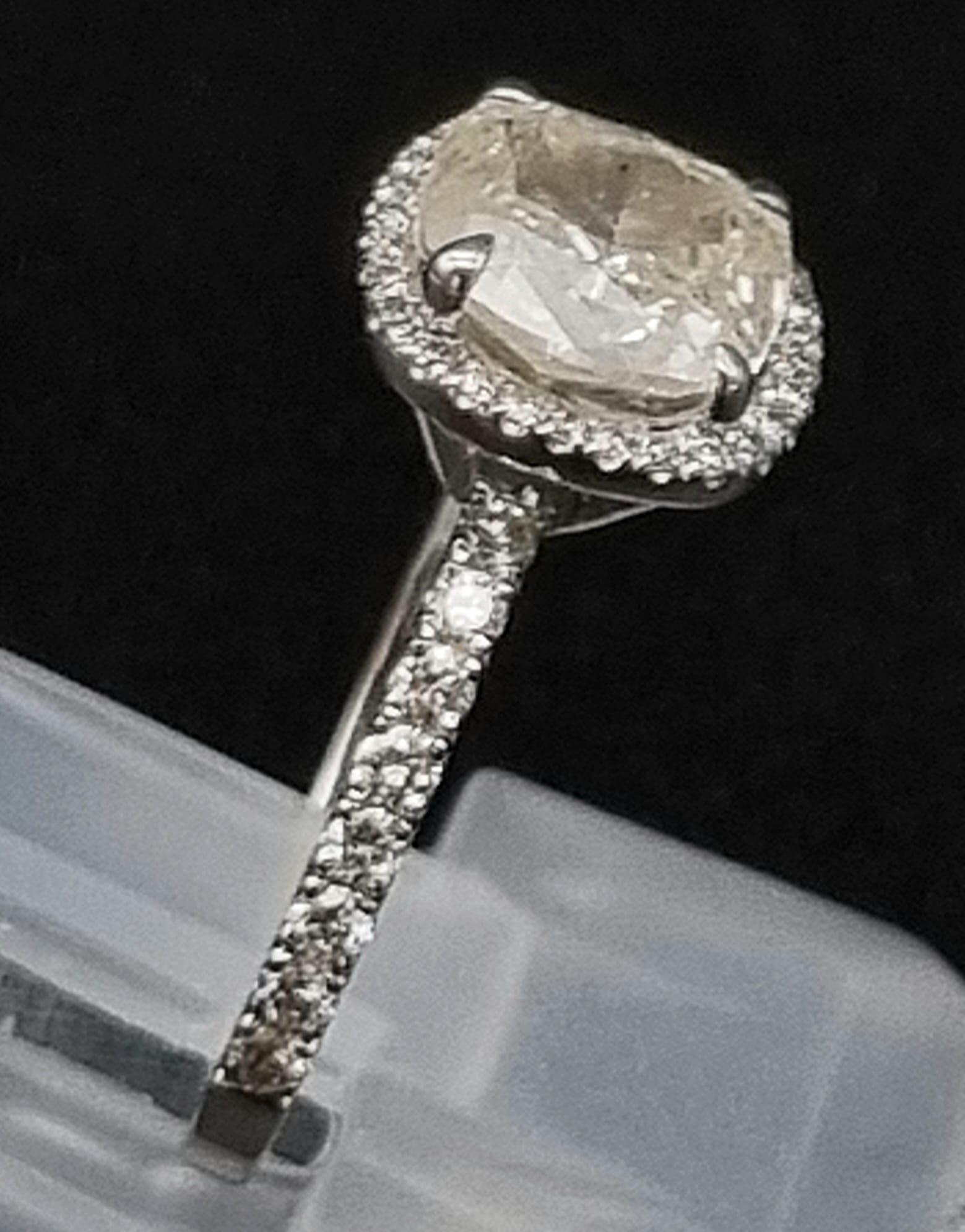 A Breathtaking 18K White Gold and Diamond Ring. A central 1.96ct cushion-cut central stone with 44 - Image 4 of 7