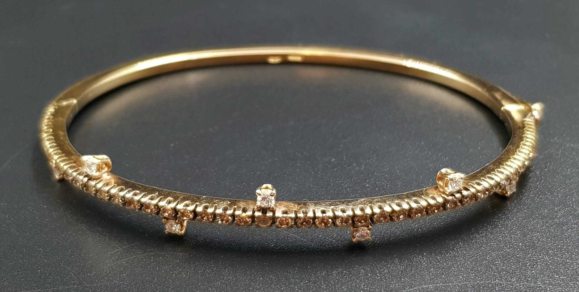 A VI NTAGE 18K ROSE GOLD AND DIAMOND BANGLE WITH BEAUTIFULLY DESIGNED DIAMONDS. 13.6gms - Image 2 of 7