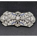 A Vintage Art Deco Diamond and Sapphire Brooch. Butterfly design with large central diamond