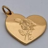 A TIFFANY 18K ROSE GOLD HEART PENDANT WITH ROSE ENGRAVING. 7.8gms