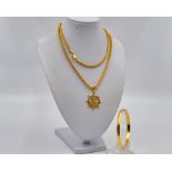 A 22K Yellow Gold Nixed Lot - A Chain, a bangle and an anchor pendant. Chain - 70cm foxtail link.