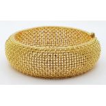 A 22k Yellow Gold Geometric Dimple Design Wide Bangle. 6cm inner diameter. 43.2g.