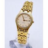 An 18K Gold and Diamond Audemans Piguet Ladies Watch. 18K gold strap and case - 25mm. Diamond bezel.