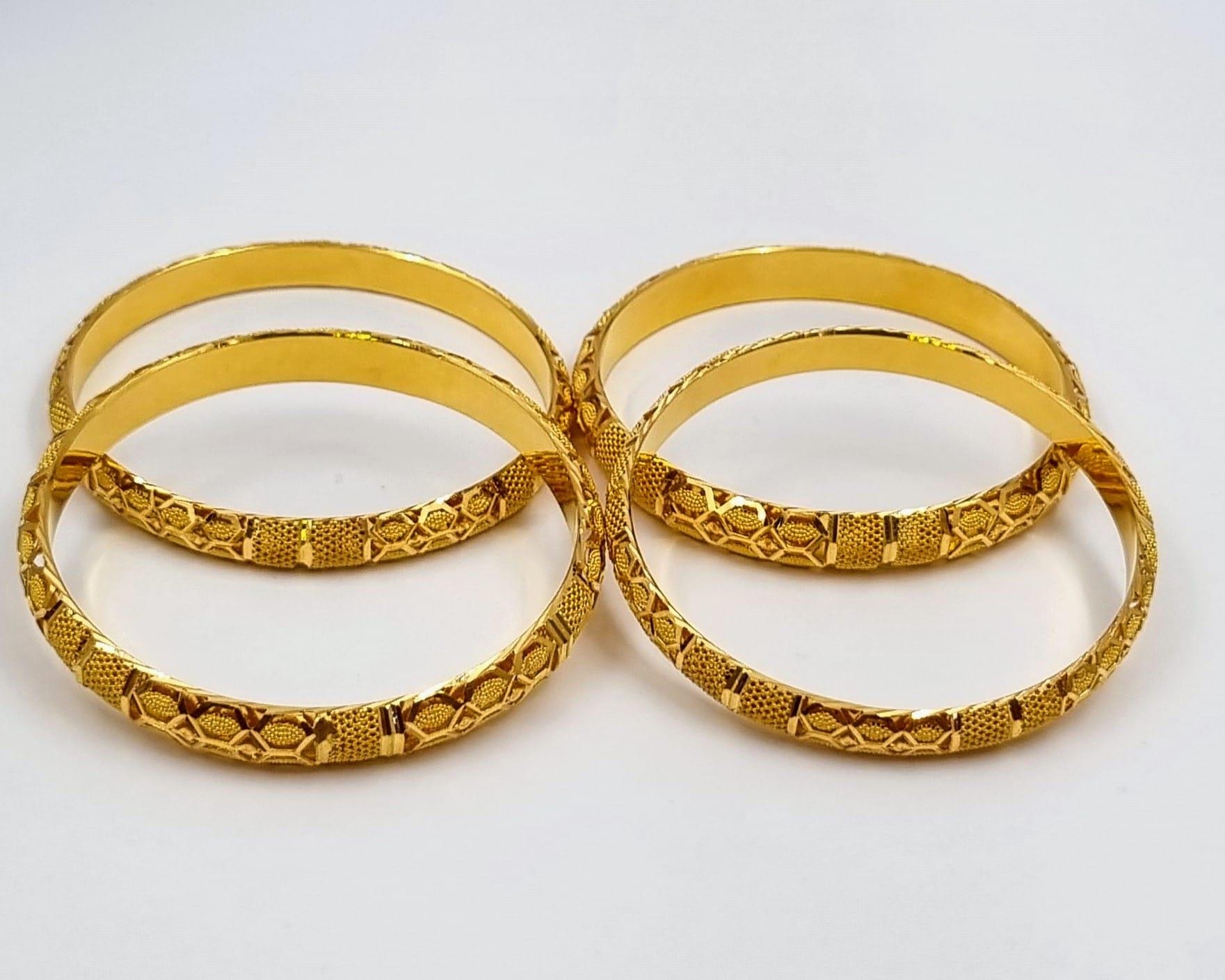 Four 22k Yellow Gold Asian Wedding Bangles. Geometric pierced decoration throughout. 6.5cm inner - Image 2 of 4