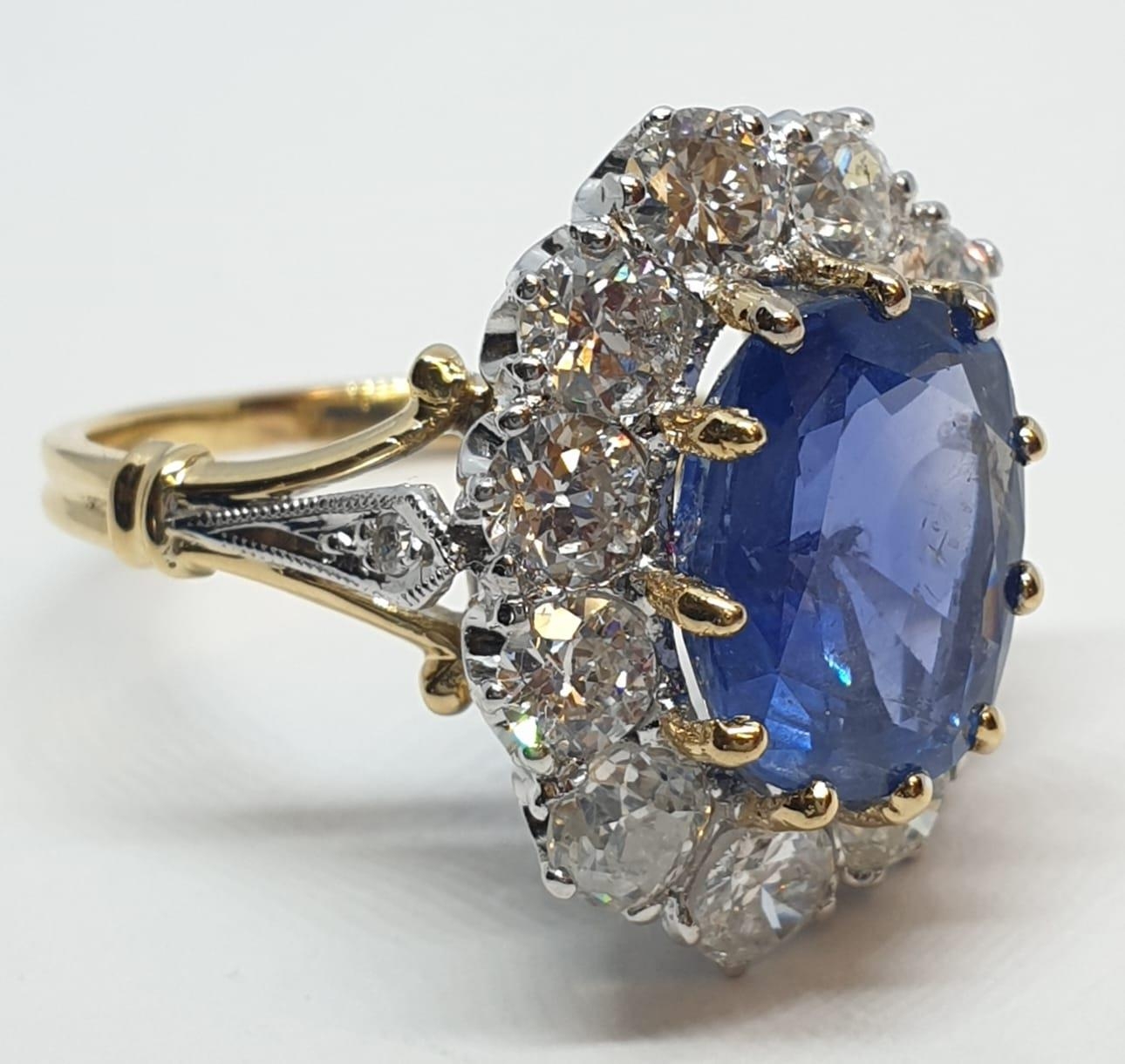 5.75ct sapphire ring set in white and yellow gold with over 3.5ct diamonds surrounding, weight 6. - Image 2 of 12