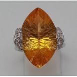 AN 18K WHITE GOLD DIAMOND AND CITRINE BESPOKE COCKTAIL RING. 12.2gms size O
