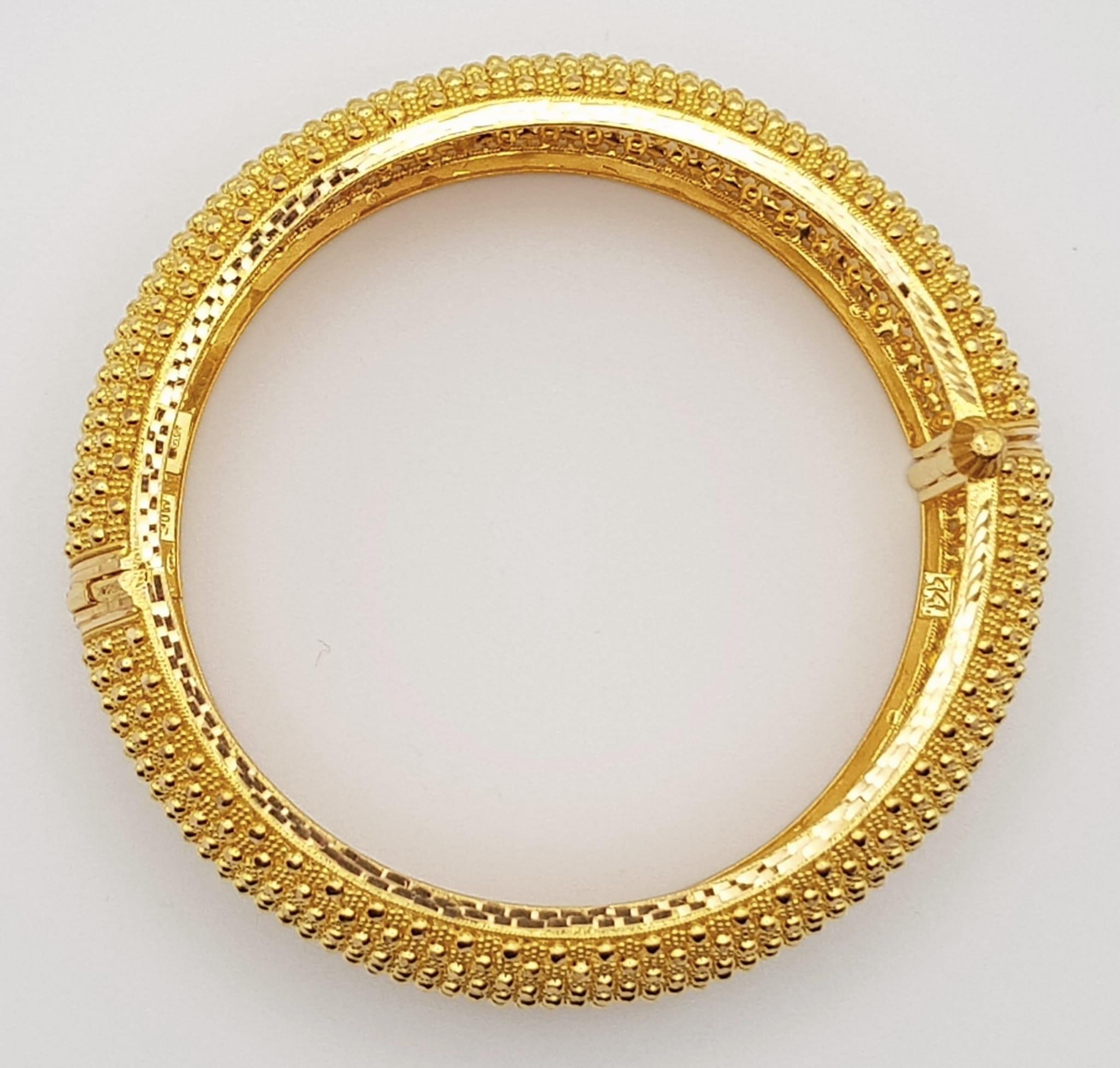 A 22k Yellow Gold Geometric Dimple Design Wide Bangle. 6cm inner diameter. 43.2g. - Image 3 of 5