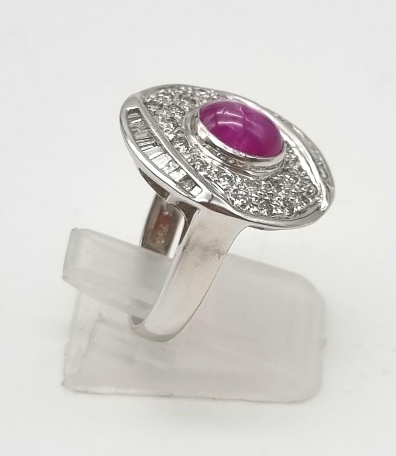 An 18K White Gold Burma Star Ruby and Diamond Ring. Central Burma Star ruby surrounded by a - Image 2 of 7