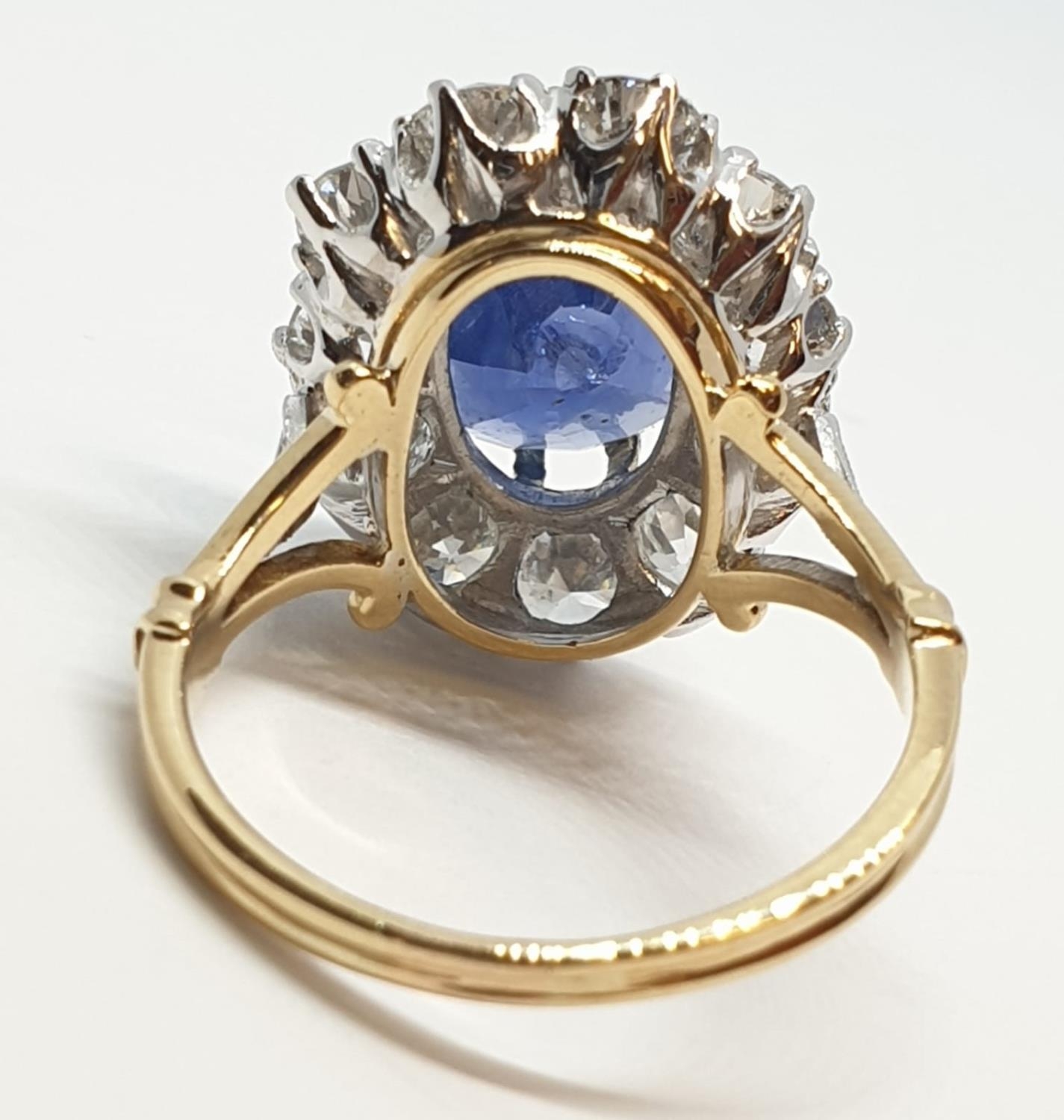 5.75ct sapphire ring set in white and yellow gold with over 3.5ct diamonds surrounding, weight 6. - Image 7 of 12