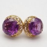A Pair of 14K Yellow Gold and Alexandrite Earrings. Stunning 2ct cabochon stone on each earring. 8.