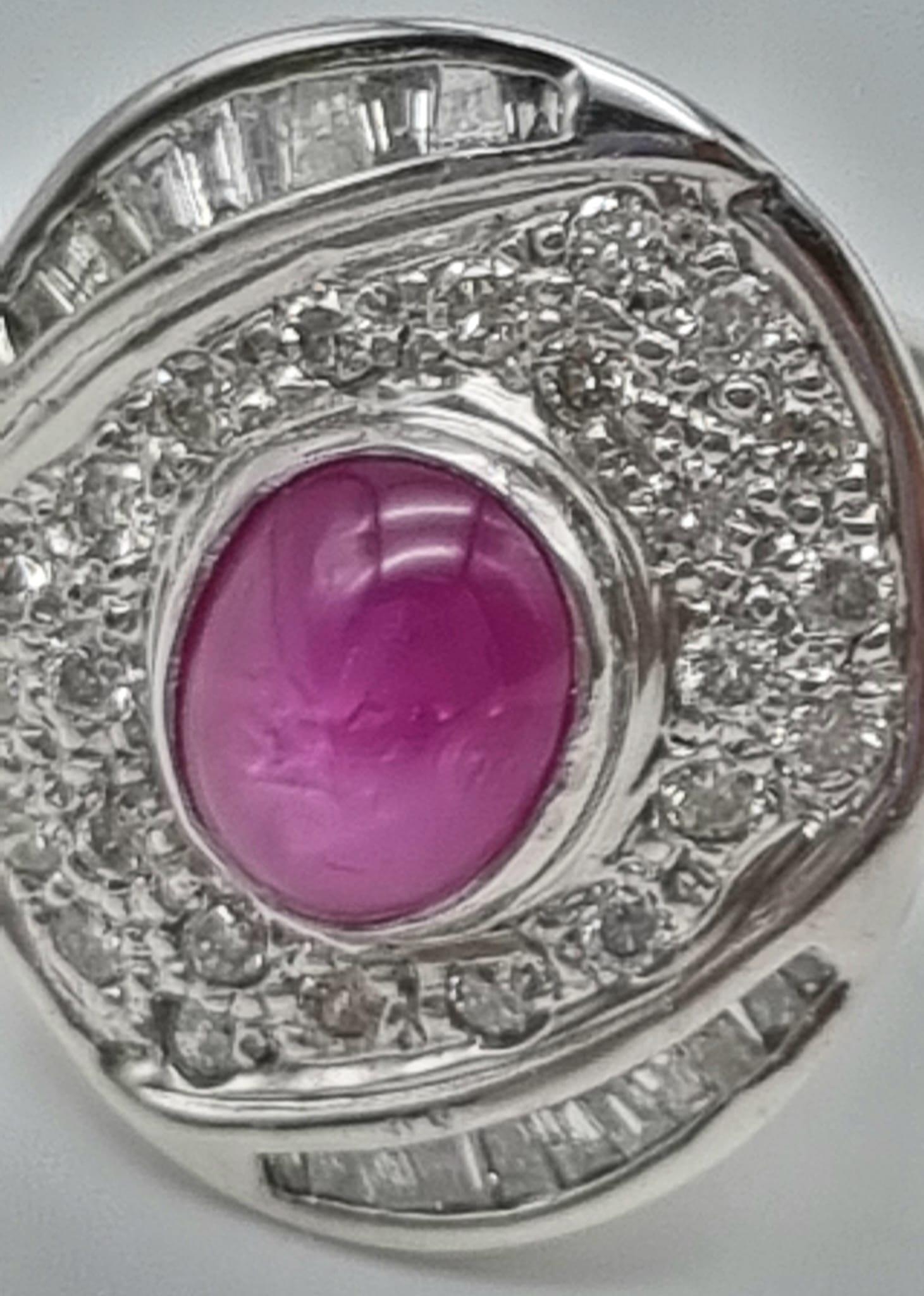 An 18K White Gold Burma Star Ruby and Diamond Ring. Central Burma Star ruby surrounded by a - Image 7 of 7