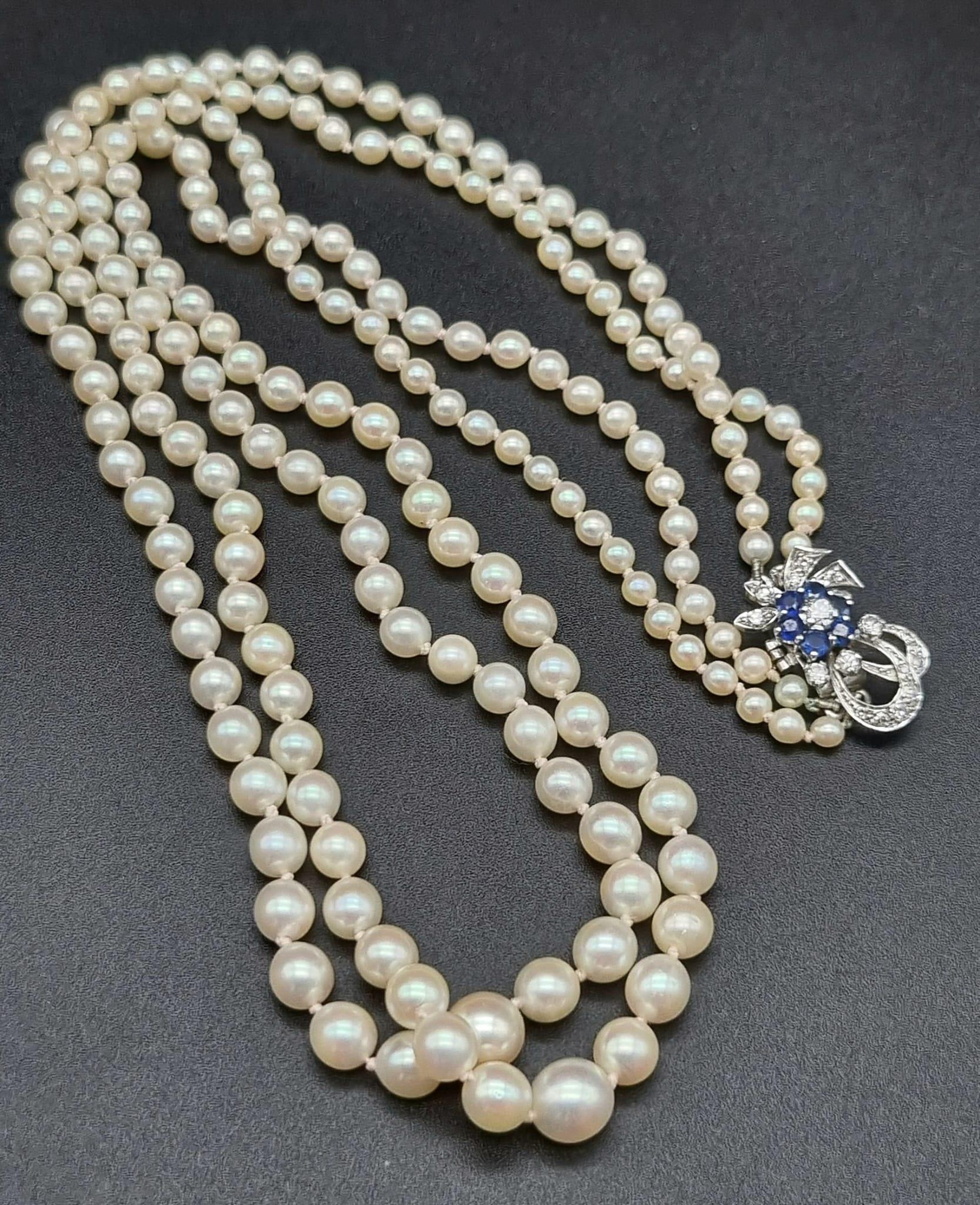 An Akoya (possibly natural) Double Strand Graduated Pearl Necklace with an 18K White Gold Diamond