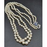 An Akoya (possibly natural) Double Strand Graduated Pearl Necklace with an 18K White Gold Diamond