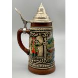 A GERZIT LIDDED BEER STEIN , CERAMIC WITH METAL LID AND "HEIDELBERG" ON THE FRONT. 6.5cms in height.