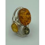 Stunning AMBER set SILVER RING having large Amber cabochon with additional Yellow and Green Amber