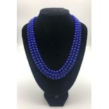 A 645ct Blue Sapphire Three-Strand Beaded Necklace. 44 - 48cm. 8mm beads.