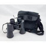 A PAIR OF NIHON BINOCULARS WITH COATED OPTIC LENSES 12 X 50 IN CARRYING CASE.