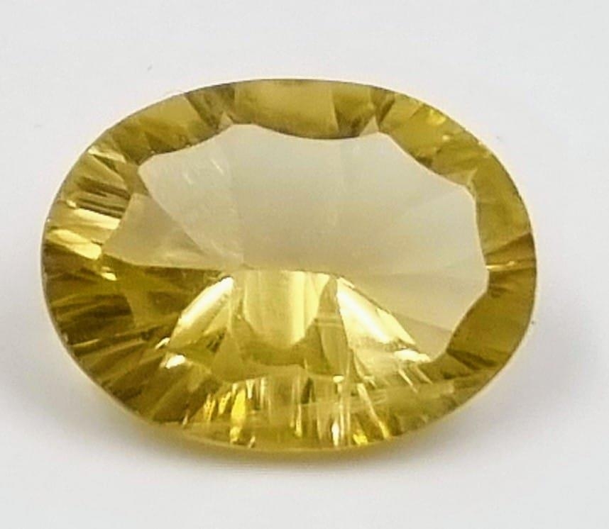 9.22ct Oval Concave Cut Lemon Quartz GLI Certified.