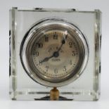 A Vintage Tit Bits Paperweight Desk Clock. 7.5 x 7.5cm. In working order.