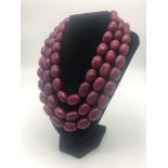 An Impressive, Over 1500ct Deep Red Ruby Necklace. Three strands of large oval ruby beads. 40 -