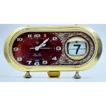 A Vintage Chinese Retro Desk Clock. Red dial with date window. In working order. 20 x 11cm.
