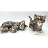 2 JENNY WINSTANLEY GLAZED CATS WITH THE TRADEMARK CATHEDRAL GLASS EYES . 20cms AND 15cms in length