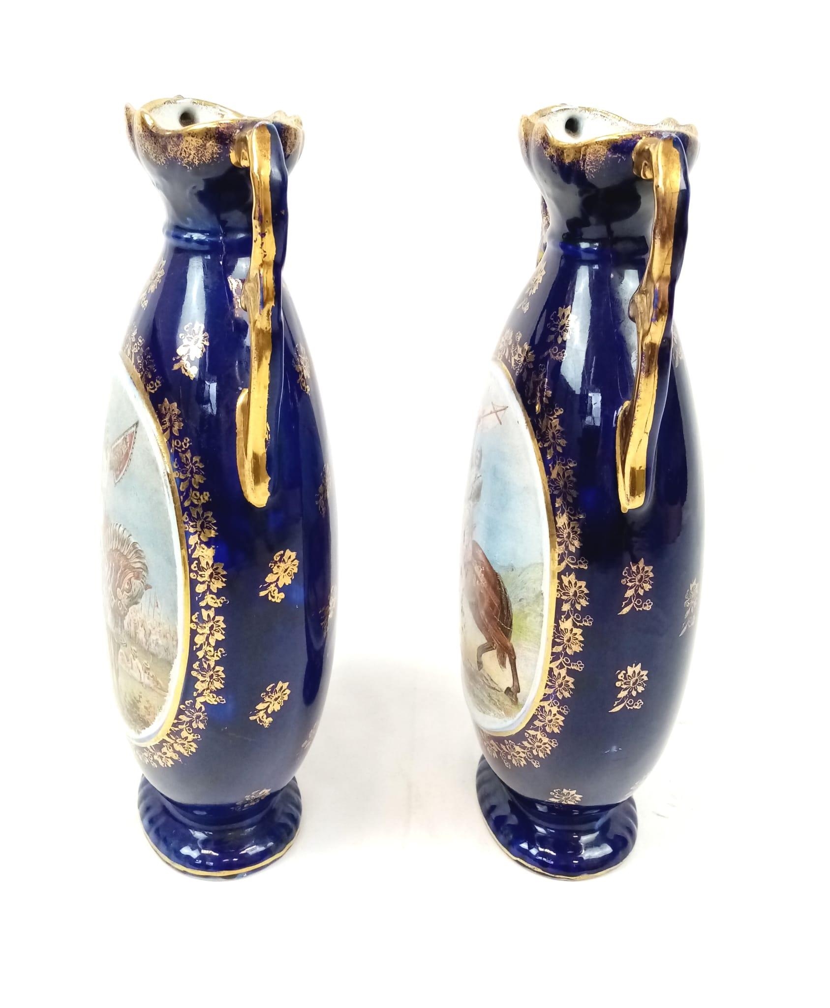 A VERY EARLY PAIR OF MACINTIRE BLUE GLAZED AND GILT VASES WITH CRUSADER PICTURES. 32cms tall. - Image 8 of 9