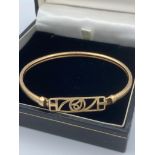 9 carat GOLD Rennie Mackintosh designed bangle. 5.3 grams approx.