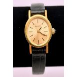 A Vintage Zenith Ladies Wristwatch. Black leather strap with gold plated case - 16mm. Gold dial.