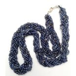 A rare and beautiful, six rows, braided, iolite necklace, in a presentation box. Necklace length: 52