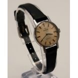 A Vintage Omega Ladies Geneve Watch. Black leather strap. Steel case - 21mm. Works but A/F.