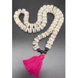 A long chunky handmade necklace, white and black tribal effect beads. 72cm in length