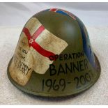 Northern Ireland Op Banner Memorial Helmet. A genuine 1960s British Army helmet decorated with a