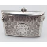 An Antique Silver Vesta Case. Geometric engraved decoration throughout with a 25yr service