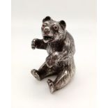 A 19th Century, German, solid silver bottle in the shape of a bear with ruby eyes. Height: 10 cm,