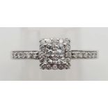 An 18K White Gold Diamond Cluster Ring. 0.38ct. Size N. 3.6g