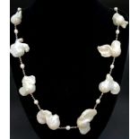 A Vintage Natural Rough Baroque Pearl and Seed Pearl Necklace. 14 Large irregular shaped natural