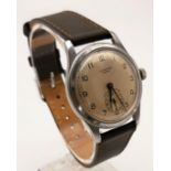 A Vintage JW Benson CYMA Military Style Watch. Leather strap and stainless steel case - 34mm. Gold