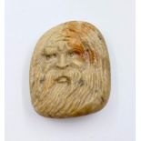 A very unusual pebble carved with a religious face, may be Persian in origin. Dimensions: 5 x 4 x
