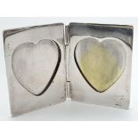 A Vintage Tiffany and Co Double Heart Silver Picture Frame. Heart shaped photo holes on interior.