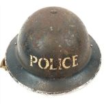 A Classic British WW2 Brodie Police Helmet. Original chin strap and Liners. Dated 1939.