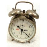 A Novelty Backwards Double Bell Alarm Clock. In working order.