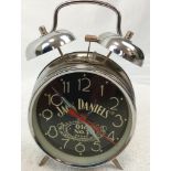 A Jack Daniels Double Bell Alarm Clock. In working order.