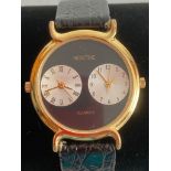 Rare and unusual MONTINE Quartz double dial wristwatch. Black face with gold tone surround. Full