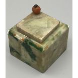 AN ANTIQUE ASIAN INK WELL MADE FROM MALACHITE WITH SWIVEL TOP. 4 X 4.5cms a/f
